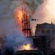 The spire of Notre Dame dramatically falling.